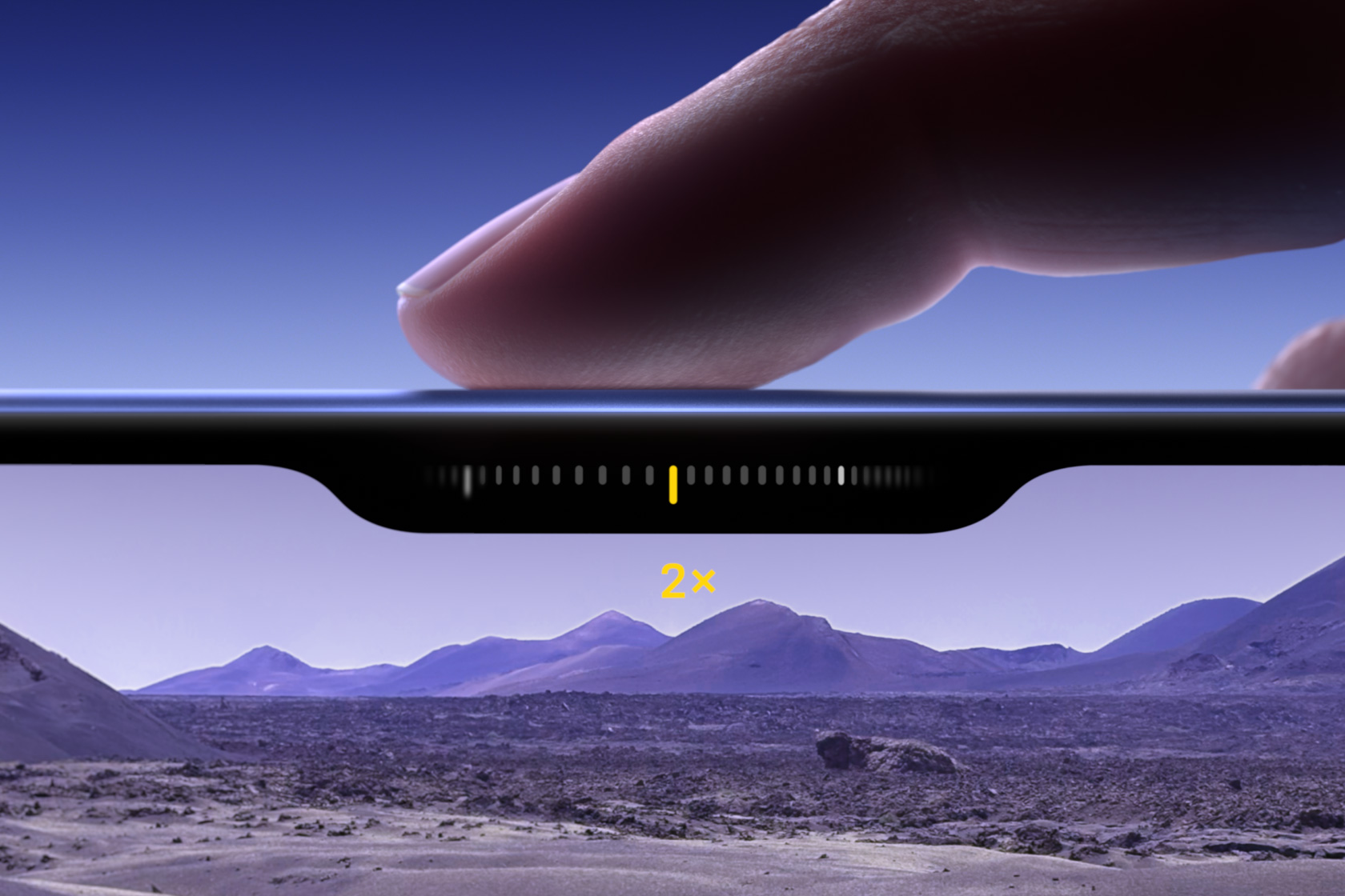 A finger slides along the Camera Control button to adjust the zoom